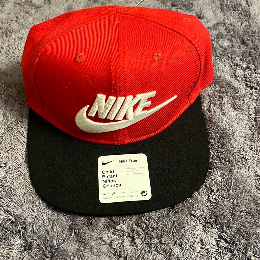 Nike embroidered Child size ball cap. Red, black and white.